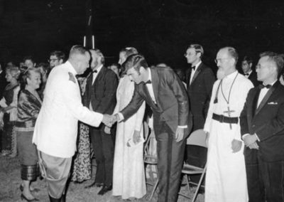 Lao King shaking hands at That Luang fair